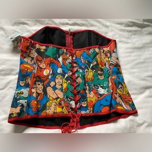DC comic corset top with boning and adjustable tie in the back.